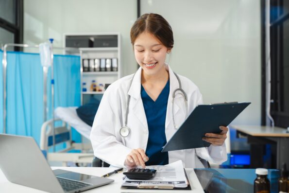 Doctor use a service fee calculator to save money on health insurance, drug cost concept.